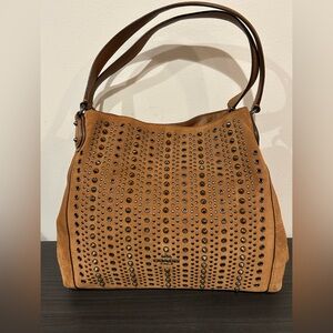 Coach Edie 31 shoulder bag in brown suede with all-over studs and grommets. EUC